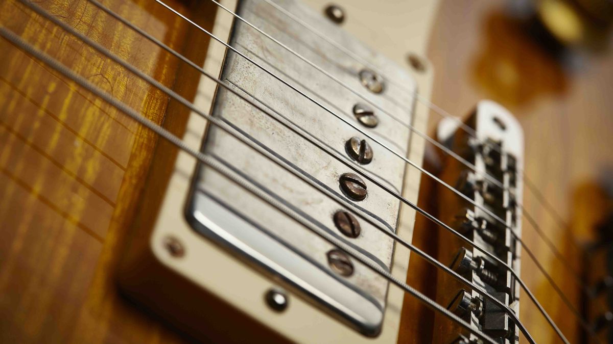 Close up of an electric guitar bridge and electric guitar bridge pickup