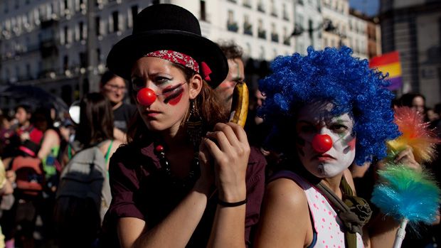 MADRID, SPAIN - MAY 15:Demonstrators with Spain&amp;#039;s Indignant movement dressed as clowns perform as policemen during a rally at Puerta del Sol on May 15, 2012 in Madrid, Spain. Spain&amp;#039;s Indignan