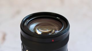 Sony E 16-55mm f/2.8 G Lens front element shown in close-up