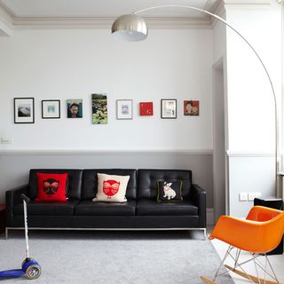 living room with white wall and photos frame