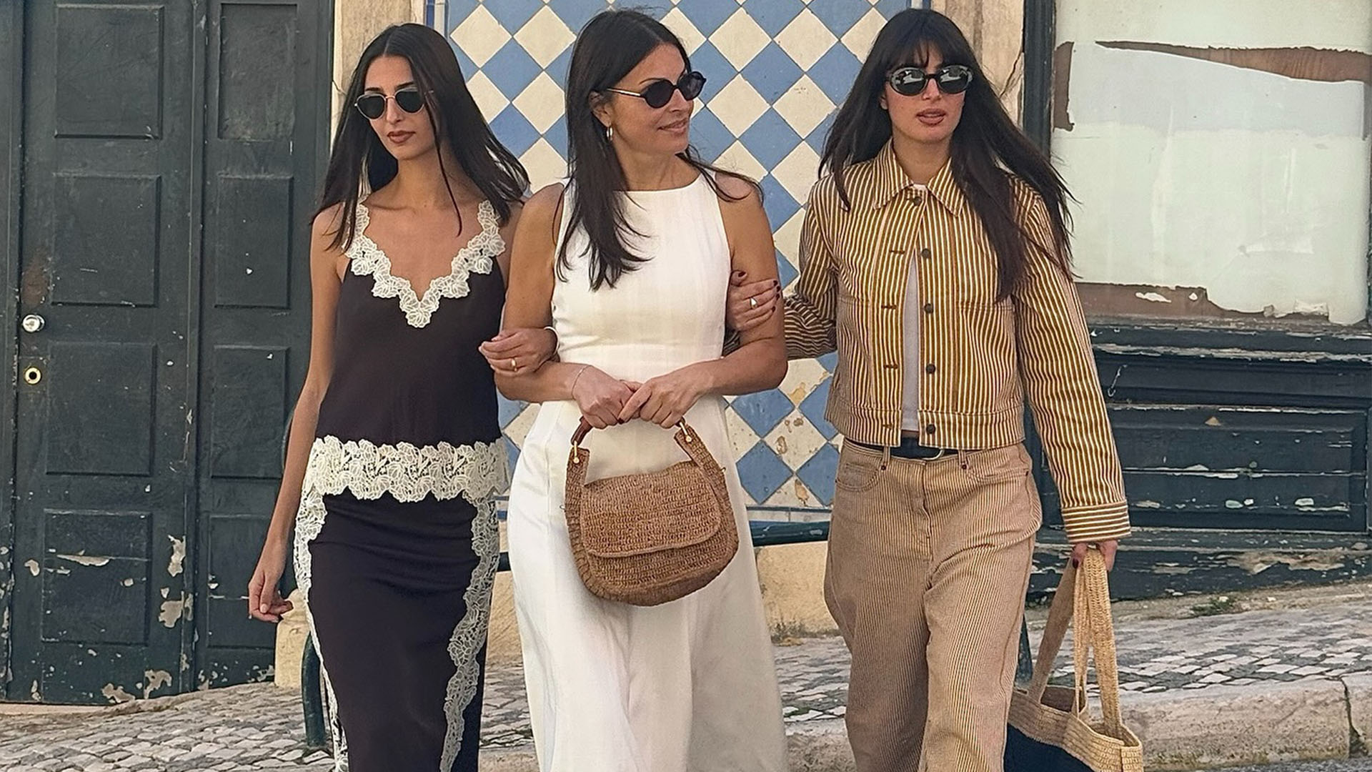 Two daughters and mother walking hand in hand