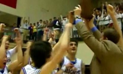 Members of the Alamo Heights high school basketball team celebrate their win against rival Edison: Some students chanted "USA" after beating predominantly Hispanic Edison.