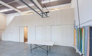 Spacious studio with table and material rolls