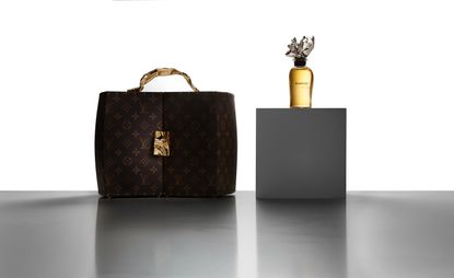 Louis Vuitton perfume with bottle and carrier trunk designed by Frank Gehry