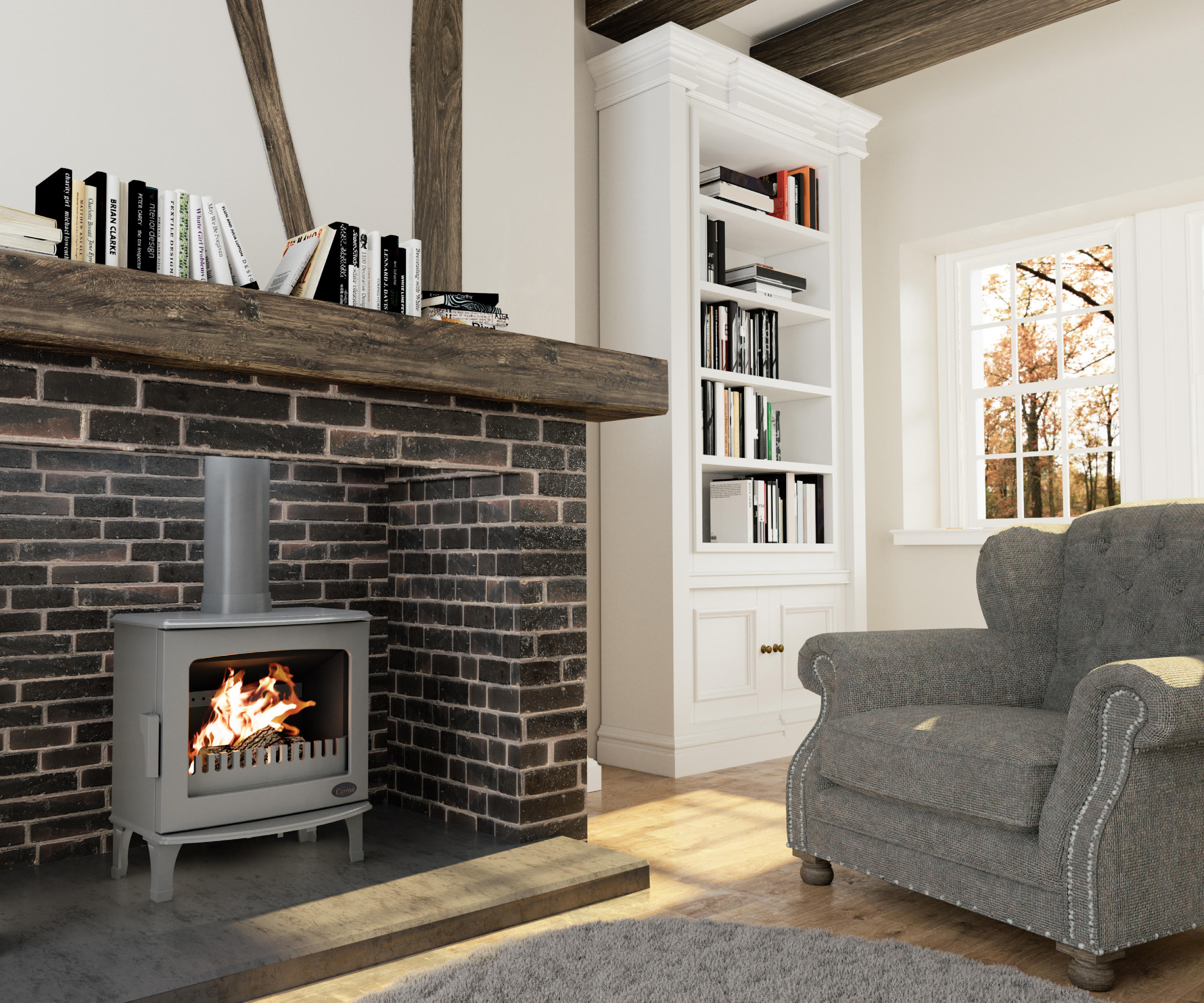 grey freestanding log burner in brick fireplace with wooden mantle and cosy grey armchair in front of fire