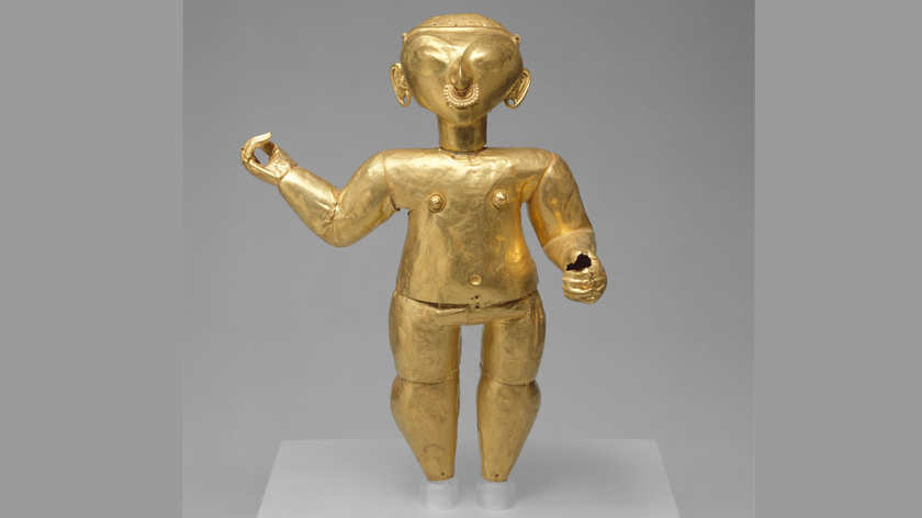 Gold statuette of a person with nose ring