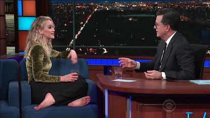 Stephen Colbert and Jennifer Lawrence share a drink