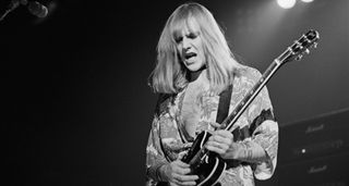 Alex Lifeson of Rush plays his Gibson semi-hollow live in 1976.