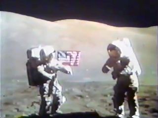 Apollo 17 astronauts Gene Cernan (at right) and Harrison Schmitt dedicate the goodwill moon rock in December 1972.