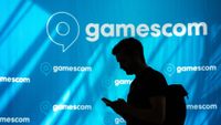 A general view of a tradefairgoer is seen walking past the Gamescom logo during the opening day of Gamescom at the Cologne Trade Fair Center in Cologne, Germany on August 23, 2023.