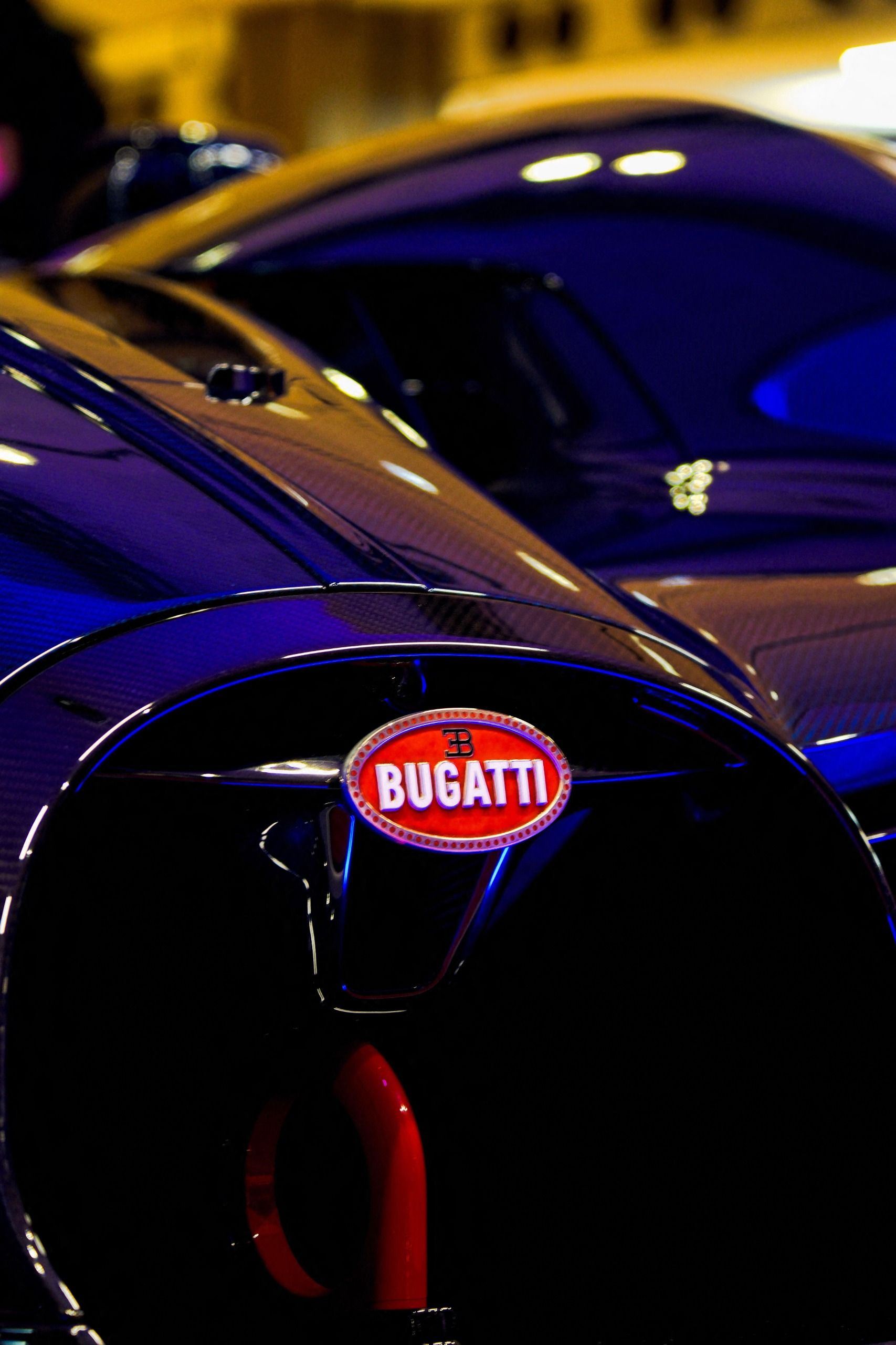 The front end of a Bugatti Bolide, zoomed in so all you can see is the grille and badge