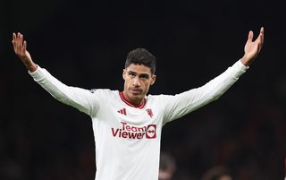 Raphael Varane reacts to the supporters during Manchester United's draw with Liverpool