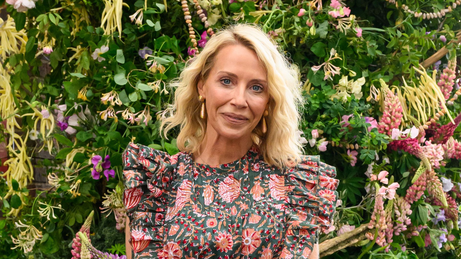 Laura Hamilton wears a Aspiga London dress and a Holland Cooper bag to attend the RHS Chelsea Flower Show 2026 at The Royal Hospital Chelsea on May 18, 2026 in London, England. 