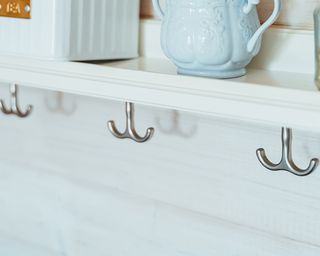 a shelf with hooks underneath, to show one of w&h's pan storage ideas