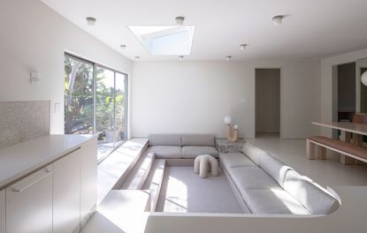 white living room with sunken seating