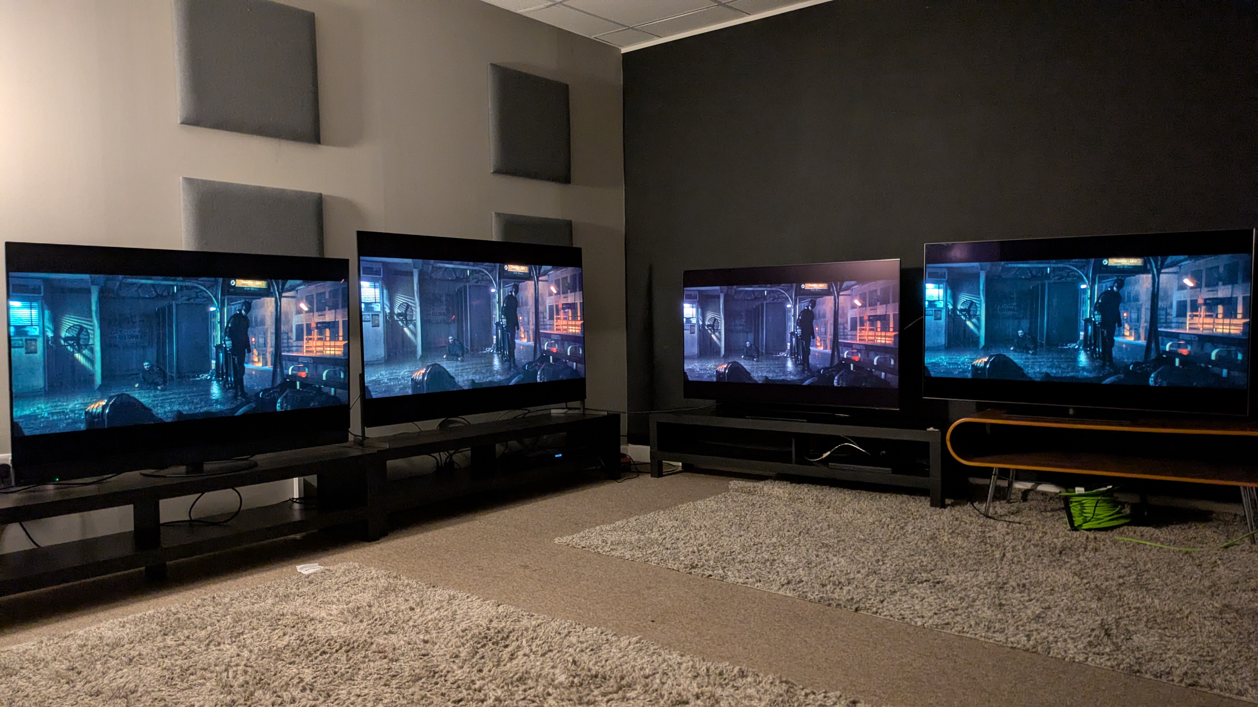 Panasonic Z95B (far left) Sony Bravia 8 II (middle left) Samsung S95F (middle right) LG G5 (far right) with The Batman subway scene on screen