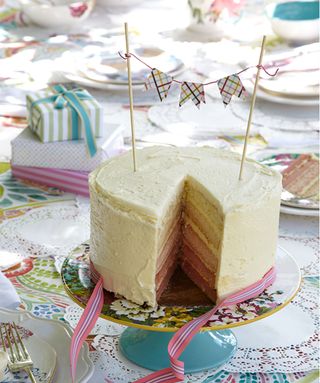 Outdoor birthday party ideas with birthday cake and bunting