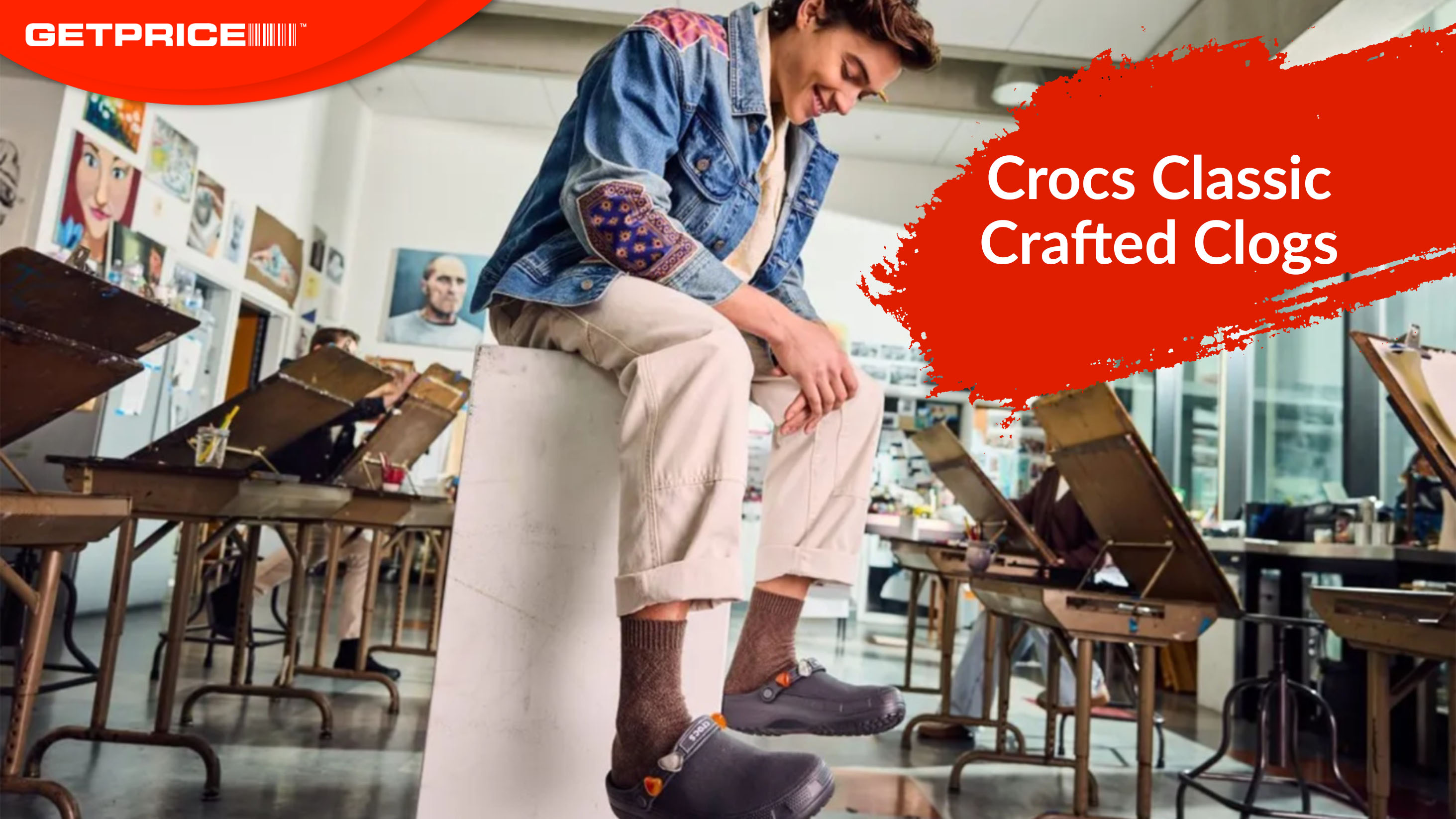 Man wearing Crafted Clogs in Black Sand with the red Getprice logo on the top left corner and a red paint splatter with white writing inside that says Crocs Classic Crafted Clogs