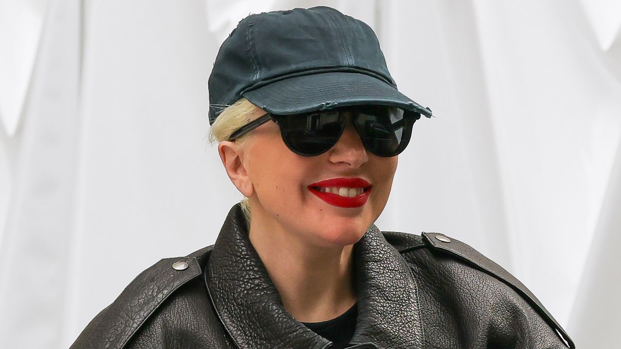 Lady Gaga pares down her larger-than-life style in a dad cap while in Paris