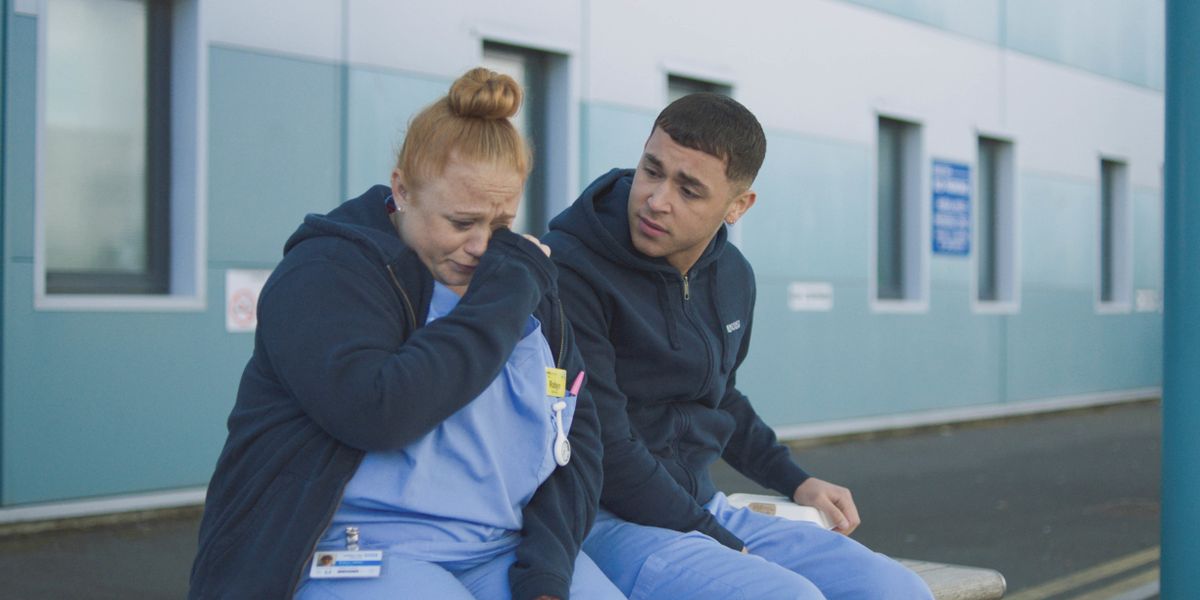 Marty comforts a crying Robyn Miller in Casualty.