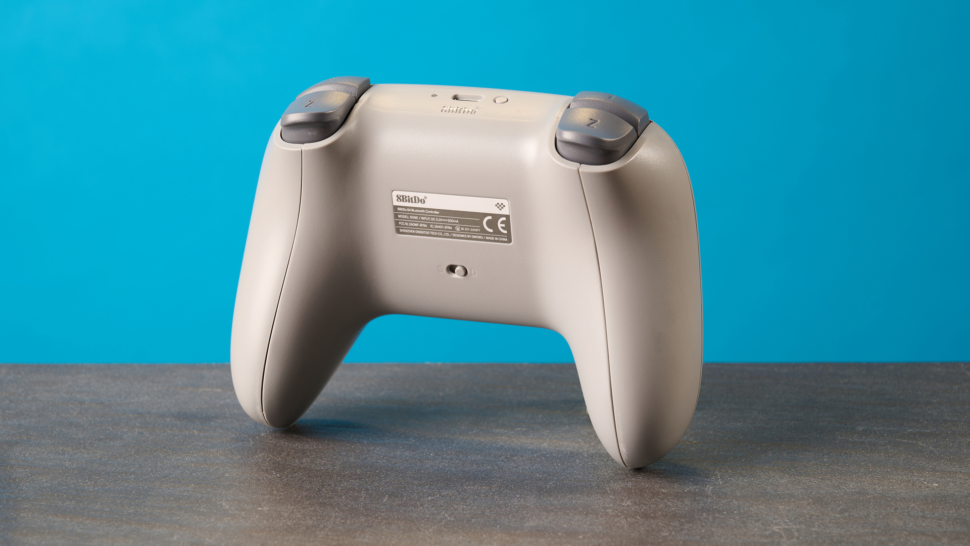 The 8BitDo 64 Controller against a blue background