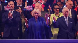 Prince William, Prince of Wales, Queen Camilla and King Charles III in the Royal Box at the Coronation Concert in the grounds of Windsor Castle on May 7, 2023