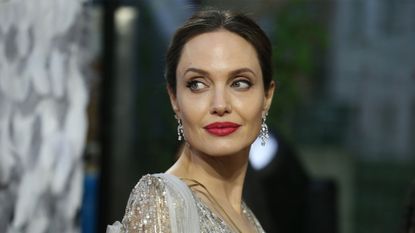 US actress Angelina Jolie poses on the red carpet upon arrival for the European premiere of the film "Maleficent:Mistress of Evil" in London on October 9, 2019. (Photo by ISABEL INFANTES / AFP) (Photo by ISABEL INFANTES/AFP via Getty Images)