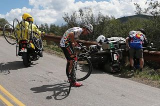 Serghei Tvetcov (Jelly Belly-Maxxis) checks on a broken wheel after colliding with a race moto during the 2014 USA Pro Challenge