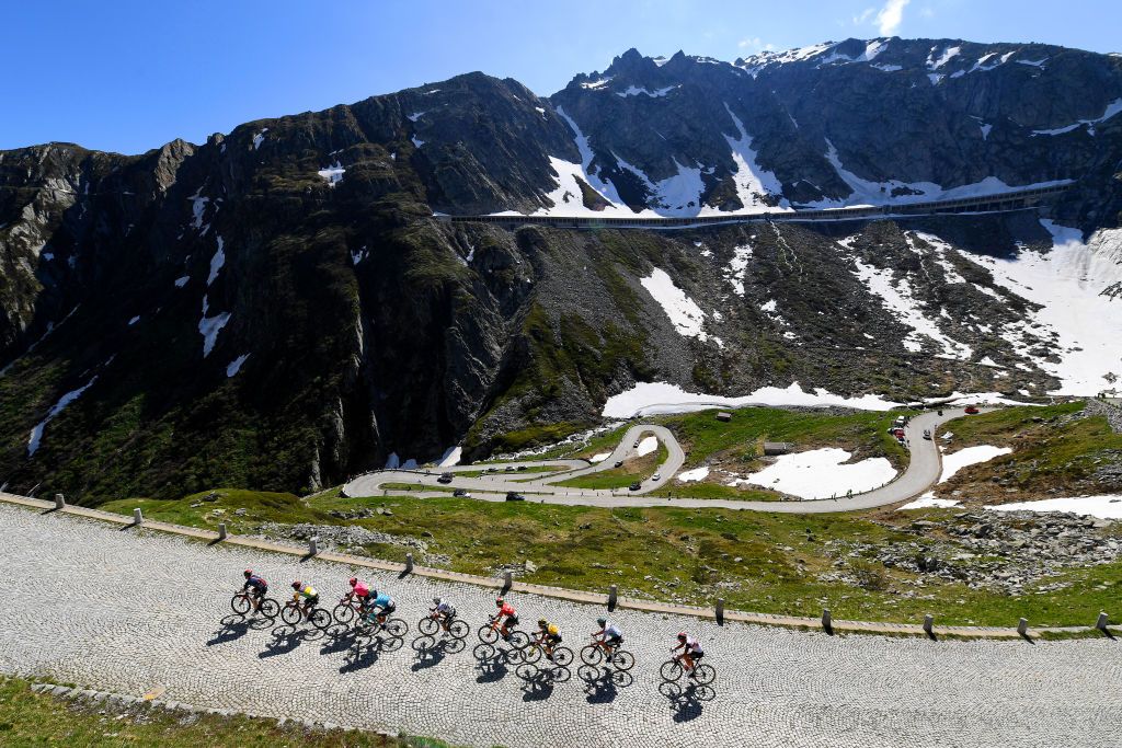 ANDERMATT SWITZERLAND JUNE 13 Maximilian Schachmann of Germany and Team Bora Hansgrohe Rui Alberto Faria Da Costa of Portugal and UAE Team Emirates Sam Oomen of Netherlands and Team Jumbo Visma Domenico Pozzovivo of Italy and Team Qhubeka Assos Mattia Cattaneo of Italy and Team Deceuninck QuickStep Rigoberto Uran Uran of Colombia and Team EF Education Nippo Jakob Fuglsang of Denmark and Team Astana Premier Tech Richard Carapaz of Ecuador and Team INEOS Grenadiers yellow leader jersey Eddie Dunbar of Ireland and Team INEOS Grenadiers in breakaway during the 84th Tour de Suisse 2021 Stage 8 a 1595km stage from Andermatt to Andermatt Gotthardpass 2106m Mountain Snow Landscape Cobblestones UCIworldtour tds tourdesuisse on June 13 2021 in Andermatt Switzerland Photo by Tim de WaeleGetty Images