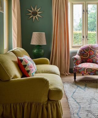 cozy green living room with an apple green skirted couch and colorful textiles