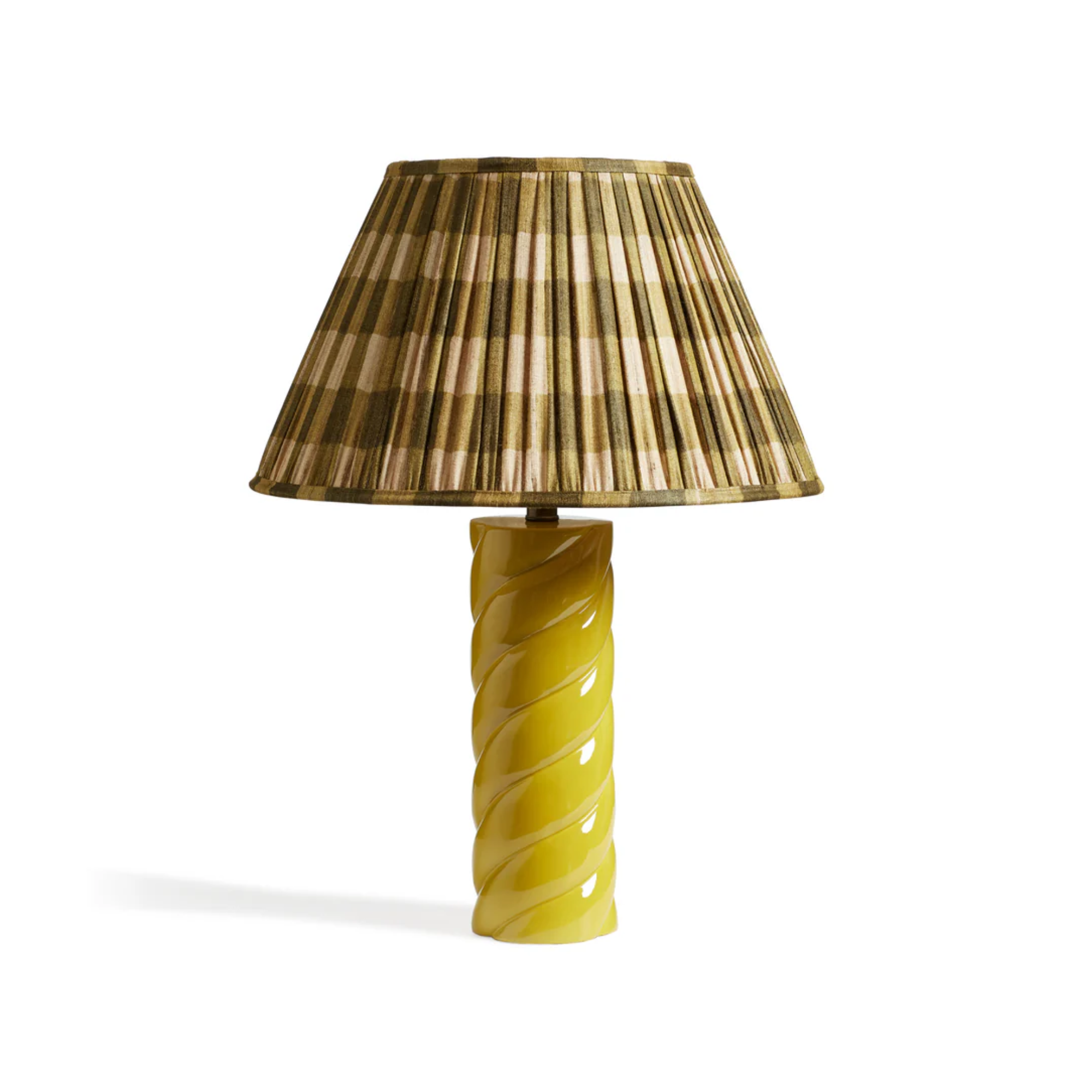 a lamp with a twisted yellow base and a green pleated shade