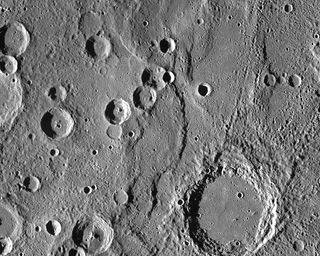 Endeavour Rupes, the shadowed escarpment in the middle of a 400km wide view of Mercury.