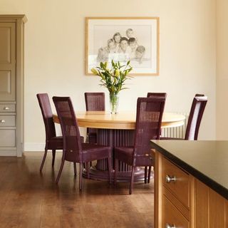 dining table with flower vase on wooden flooring