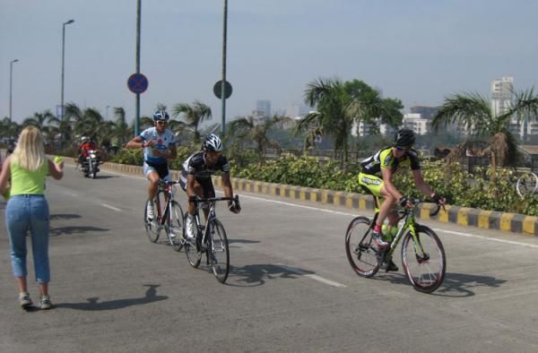 The front group in the Mumbai Cyclothon getting some drinks from the feed zone in the hot weather in India.