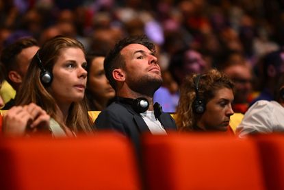 Mark Cavendish watches the route presentation of the 2024 Tour de France