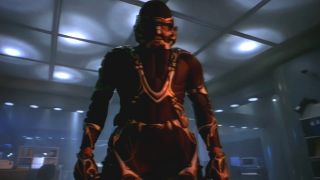 Carl Lumbly stands in his M.A.N.T.I.S. suit in the lab in M.A.N.T.I.S.