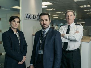 Martin Compston as DS Steve Arnott in Line of Duty (centre), with Vicky McClure as DI Kate Fleming (left) and Superintendent Ted Hasting (right).