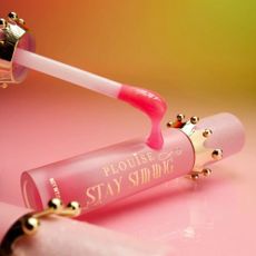 P. Louise 'Stay Shining' pink lip gloss on pink to green/yellow ombre background.