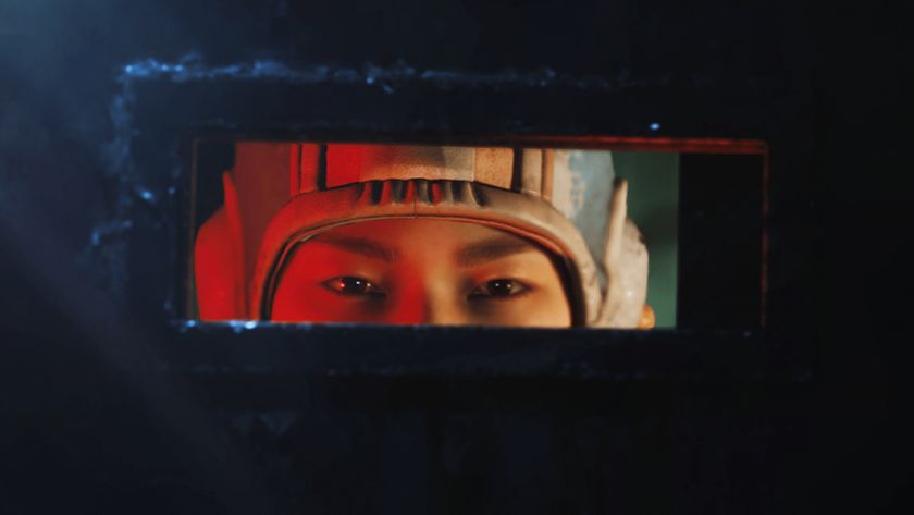 Arc Raiders Market Correction: A close-up of Tian Wen as she peeks through the small, horizontal window of her metal door.