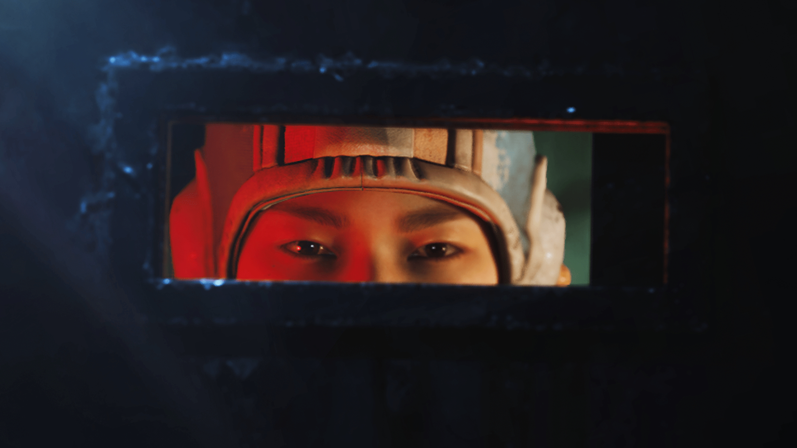 Arc Raiders Market Correction: A close-up of Tian Wen as she peeks through the small, horizontal window of her metal door.