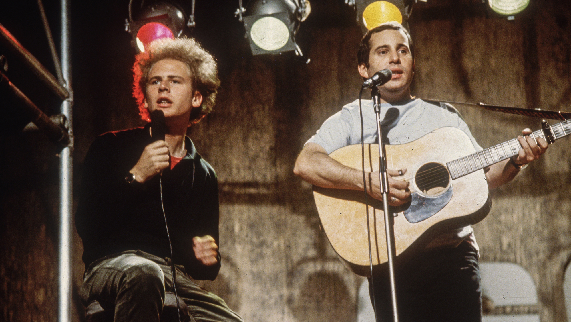 Simon and Garfunkel, comprising (L-R) singer, Art Garfunkel and singer-songwriter, Paul Simon, performing on ITV's 'Ready, Steady, Go!', July 8, 1966. 