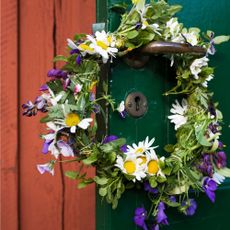 Flower wreath hanging on door
