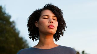 Woman closed eyes in mindfulness exercise