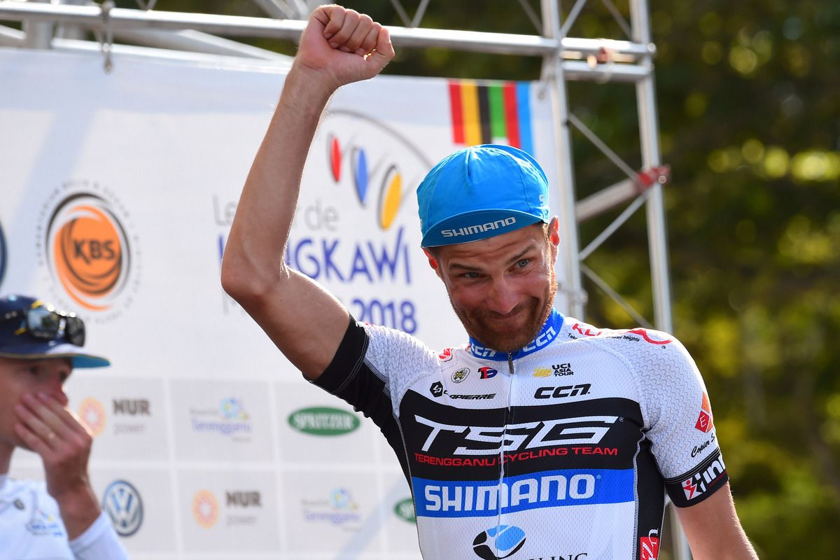 Artem Ovechkin (Terengganu) on stage to collect the yellow jersey