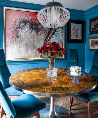 eat-in kitchen with round table and blue walls