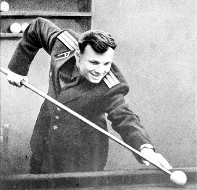 In a lighter moment, cosmonaut Yuri Gagarin - the first human to fly in space - poses for a photo while playing billiards.