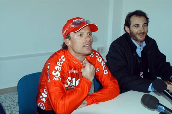 Danilo Di Luca pictured alongside Stefano Diciatteo of RCS Sport at a post-stage press conference in Toricella, 2003.