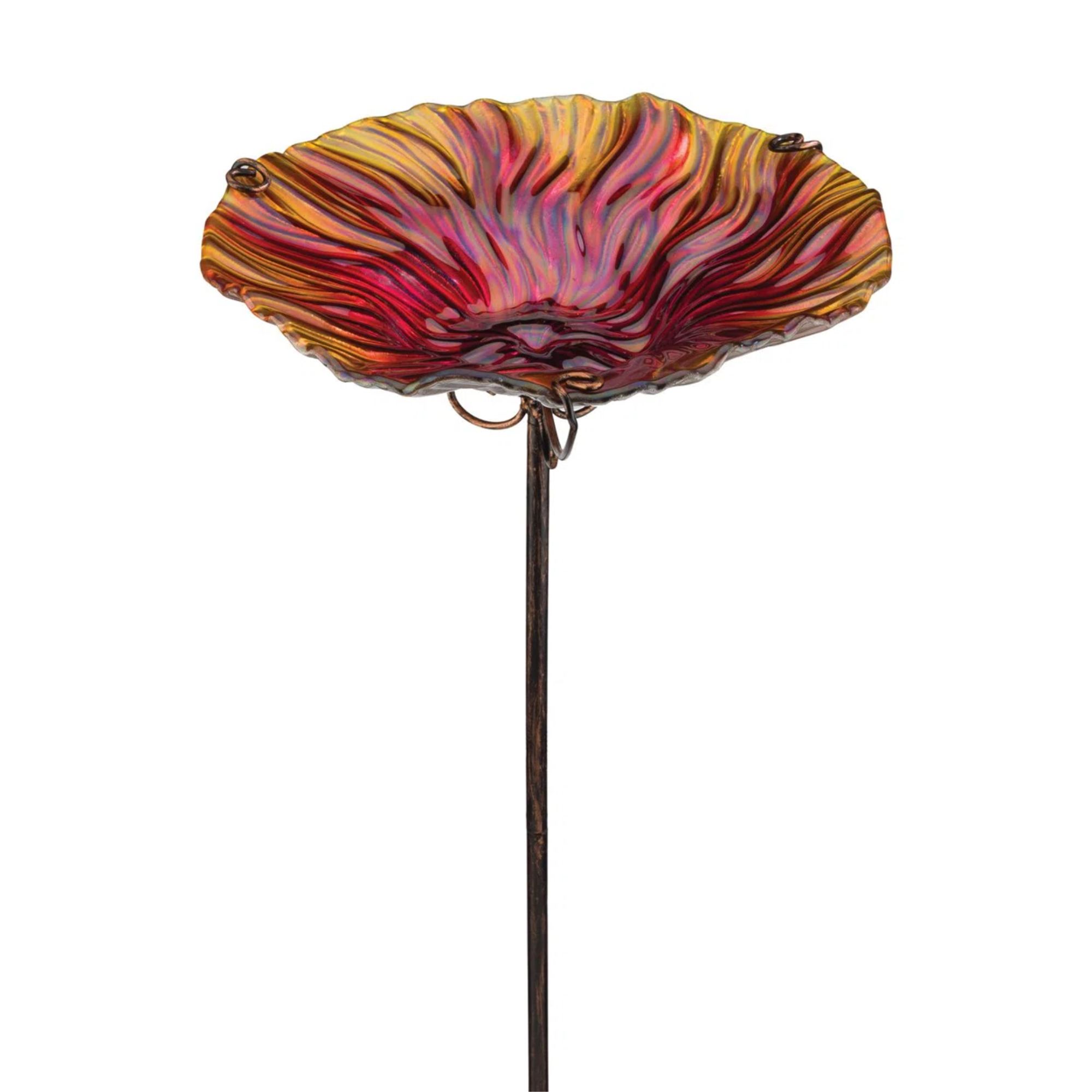 Glass bird bath with red flower basin and metal pole