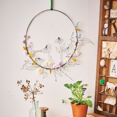 Wire spring wreath with polymer flowers