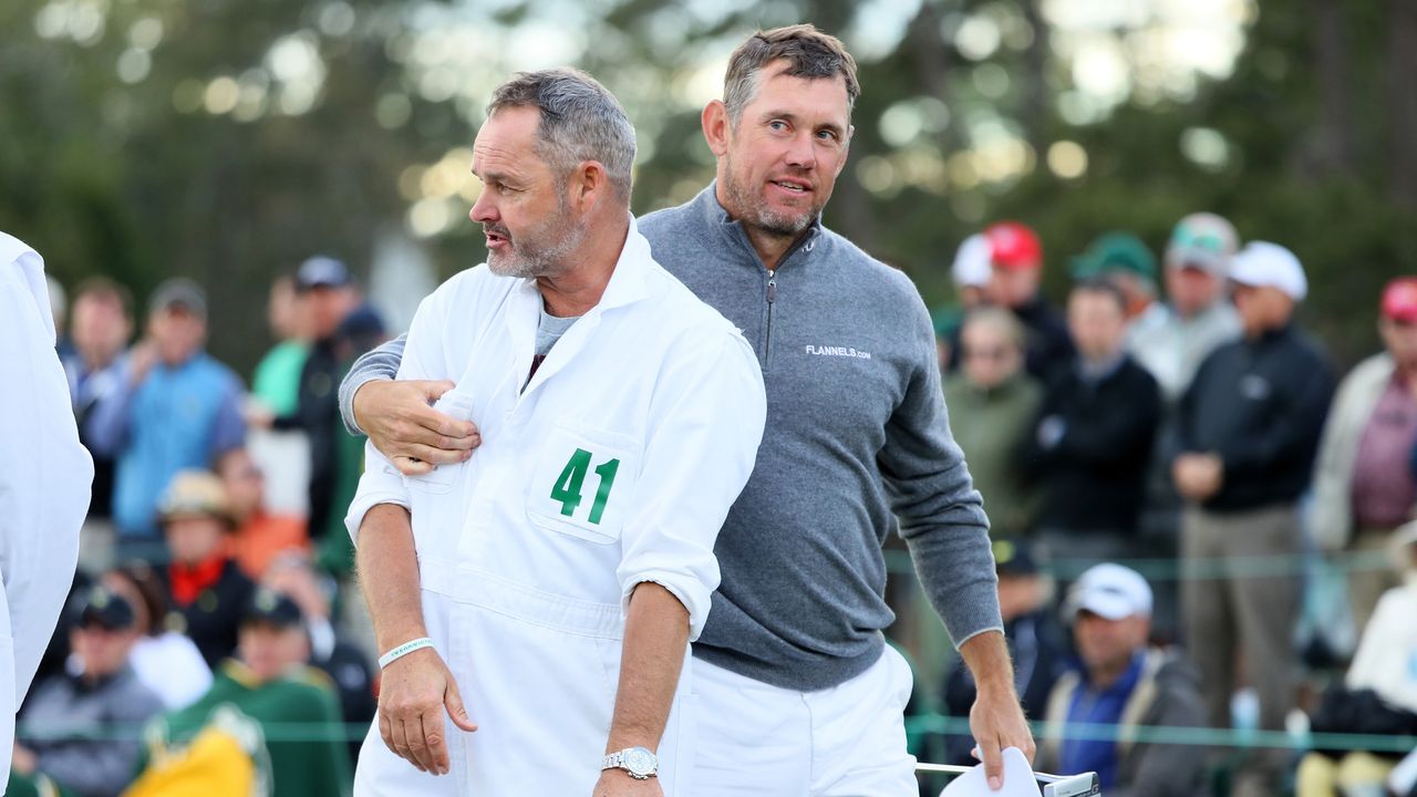 Billy Foster and Lee Westwood on the 18th green during the first round of the 2017 Masters